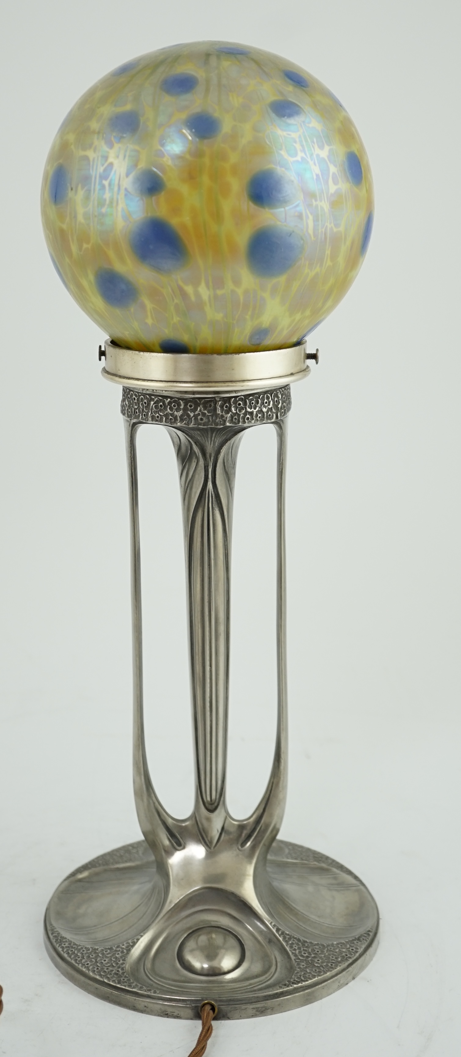 An Art Nouveau Orivit pewter table lamp with Loetz iridescent glass globular shade